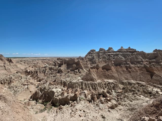 Eroded pale ridges of the Badlands under a clear sky