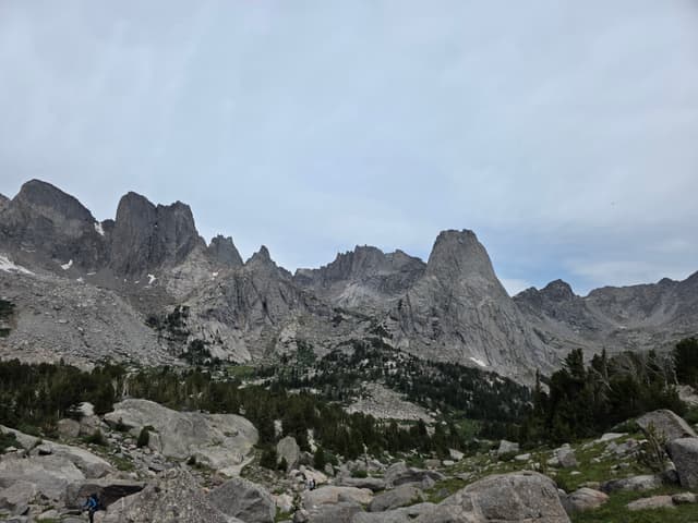 A jagged skyline of granite towers above a basin