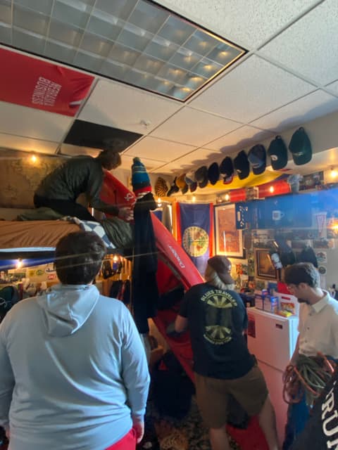 Friends browsing in a crowded shop