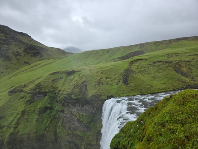 The Skógá river cutting through a deep green gorge